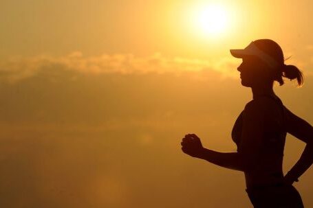 Endurance Boost - Woman With White Sunvisor Running