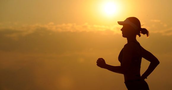 Endurance Boost - Woman With White Sunvisor Running