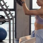 Strong Arms - Photo of Woman Sitting and Raising Dumbbells