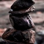 Improve Stability - Close-up on Stack of Wet Rocks