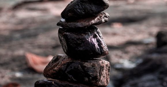 Improve Stability - Close-up on Stack of Wet Rocks