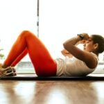 Exercise - woman exercising indoors