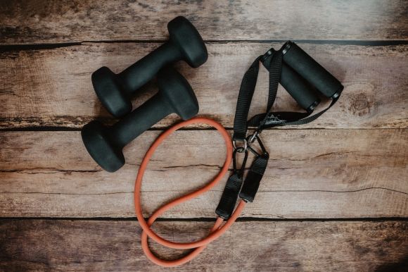 Exercise - orange and black usb cable on brown wooden surface