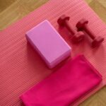 Exercise - pink dumbbell on pink textile