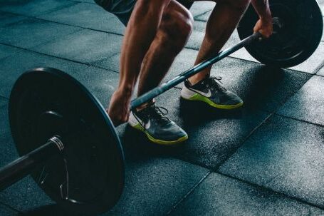 Strength Training - Person Holding Barbell