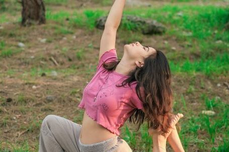 Efficient Fitness - Woman Practicing Yoga in Forest