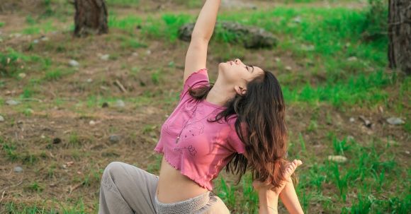 Efficient Fitness - Woman Practicing Yoga in Forest