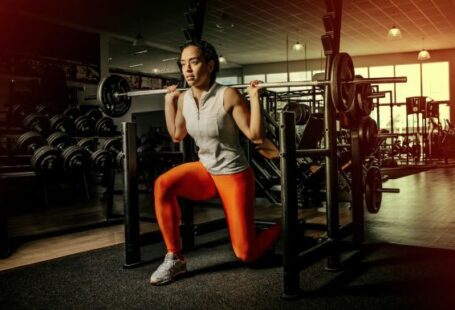 Ball Exercise - woman wearing gray shirt and orange leggings