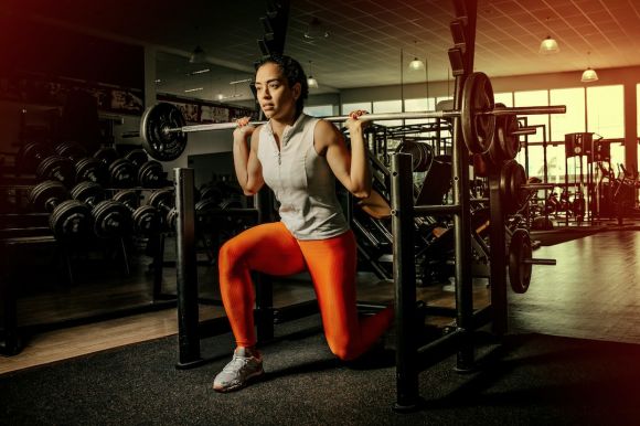 Ball Exercise - woman wearing gray shirt and orange leggings