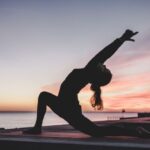 Exercise - silhouette photography of woman doing yoga