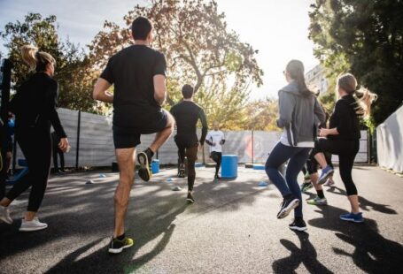 Warm-up - man in black t-shirt and black shorts running on road during daytime