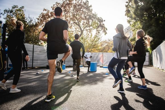 Warm-up - man in black t-shirt and black shorts running on road during daytime